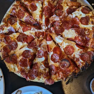 Yummy large pepperoni served hot.
