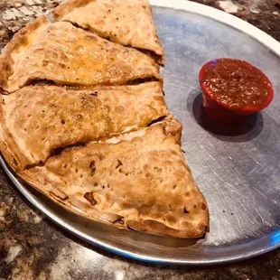 The calzone here takes the folded pizza idea pretty literally