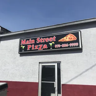 There is no sign on the front of the building, this is the back entrance with a large shared parking area.