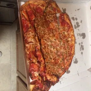 Teach the blonde male employee how to carry a freaking pizza. That goes for the rest of the employees too. RIDICULOUS