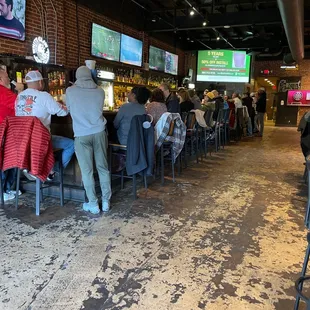 people sitting at the bar