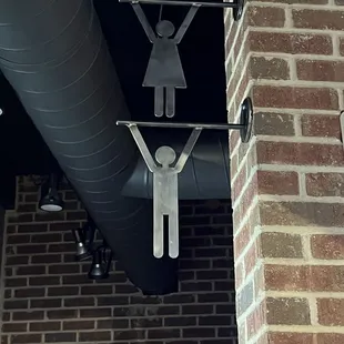 Restrooms on the left side of the bar
