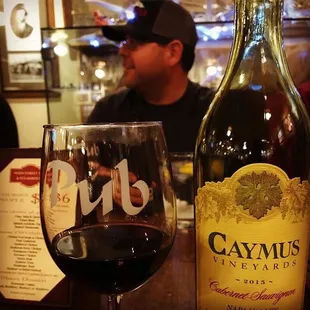 a glass of wine and a bottle of wine