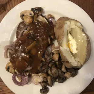 Hamburger steak and baked potato.