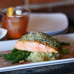 PESTO SALMON: Seared salmon, pesto and herbed bread crumb topping, cilantro lime rice, asparagus