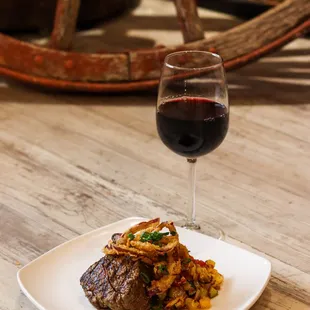 FILET MIGNON
 Choice 7 oz tenderloin, fried onion straws,
 asparagus, roasted red skins, zip sauce