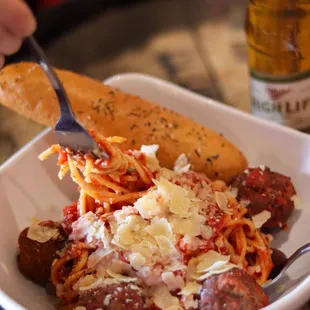 SPAGHETTI WITH MEATBALLS: Spaghetti pasta, tomato sauce, meatballs, shaved parmesan. Served with a breadstick (can also make it baked!).