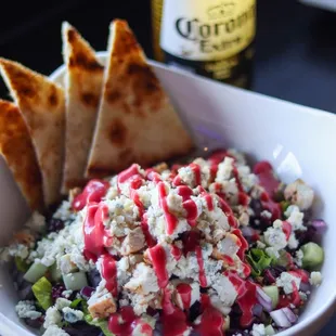 CRANBERRY WALNUT SALAD: Grilled chicken, mixed lettuce, bleu cheese crumbles, red onion, cucumber, candied walnuts, dried cranberry