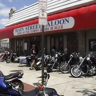 motorcycles parked in front of the restaurant