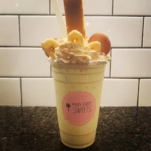 a banana milkshake in a cup