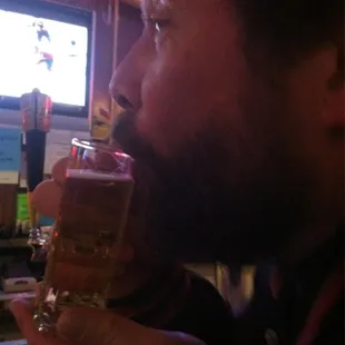 a man drinking a beer