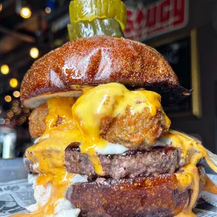 a burger with a pickle on top