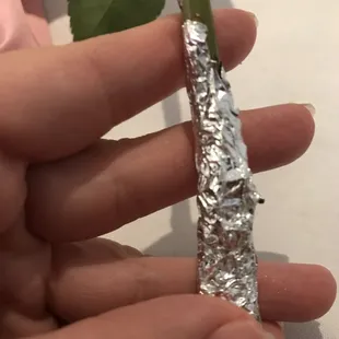 They handed each mom a rose covered in thorns, used foil to protect hands...thorns poked right through