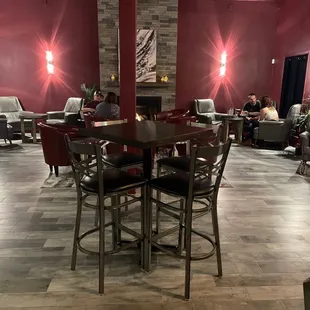 people sitting at tables in a restaurant