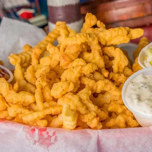 a basket of fried shrimp and coleslaw