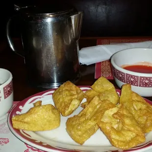 Fried Wontons,  duck sauce for dipping and hot tea in the background!