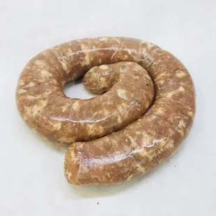 two sausages on a white surface