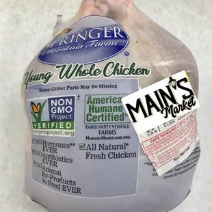 a whole chicken wrapped in plastic
