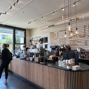 a woman standing at the counter