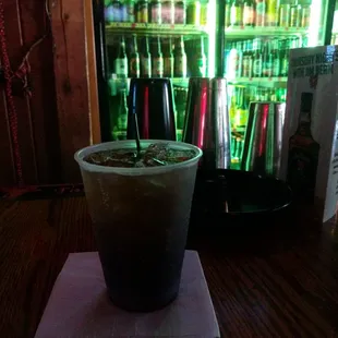 a cold beverage in a plastic cup