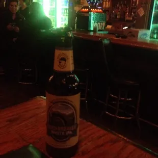 a bottle of beer on a table