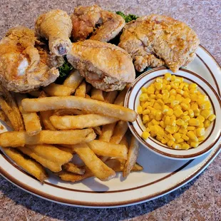 a plate of fried chicken and french fries