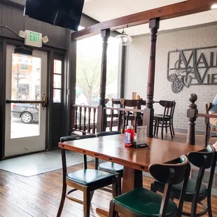 a view of a dining room with tables and chairs
