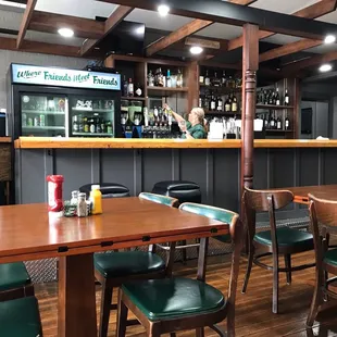 a restaurant with tables and chairs