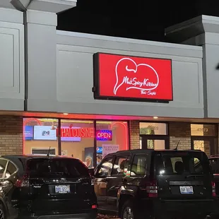cars parked in front of the restaurant