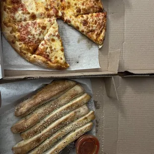 Medium cheese pizza and breadsticks