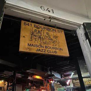 a sign hanging from the ceiling