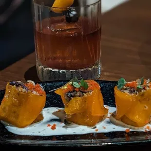 a glass of wine and a plate of food