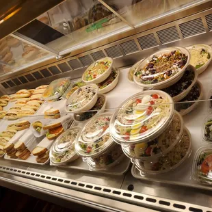 a variety of salads and sandwiches