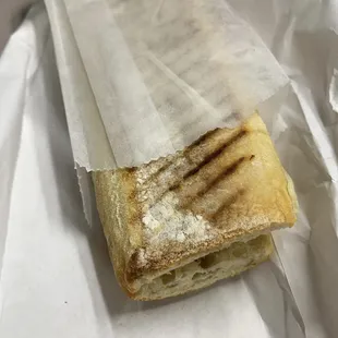 a piece of bread wrapped in wax paper