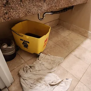 black sewer water in the mop bucket