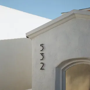 a white house with a door and window