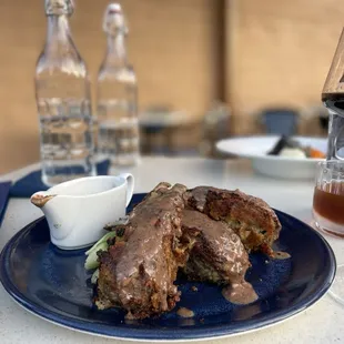 a plate of food and a glass of wine