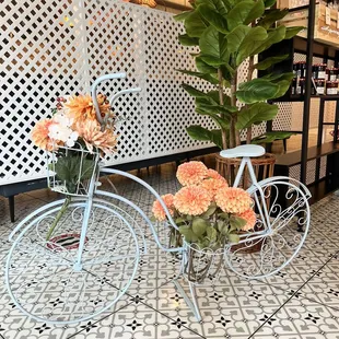 a bicycle with flowers in the basket