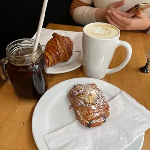 Lavender rose latte, croissant, chocolate almond croissant, iced coffee