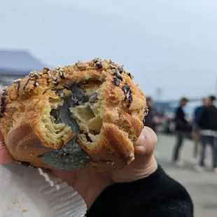 a person holding a pastry