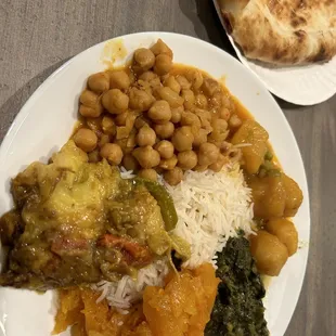 Vegetable Platter - eggplant, chickpeas, potatoes, spinach, pumpkin, rice, and bread.