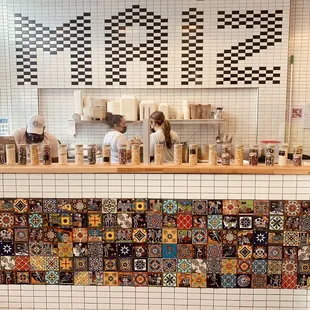 a tiled counter in a coffee shop