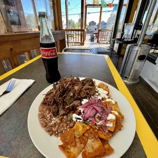 Chilaquiles with Machaca. No avocado because I am allergic to it. Delicious and a TON of delicious Machaca meat.