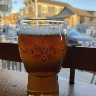 a glass of beer on a table