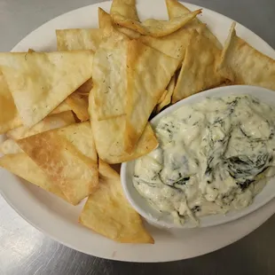 homemade spinach and artichoke dip with fresh fried pita chips