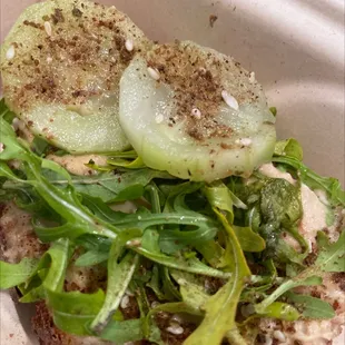 Hummus toast - with old ass cucumbers and wilted dry arugula. Disappointing.