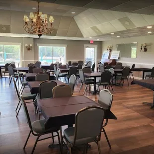 tables and chairs with chandeliers