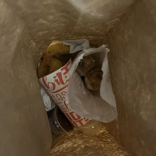 Food at the bottom of a brown lunch bag