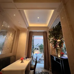 a dining room with a table and chairs