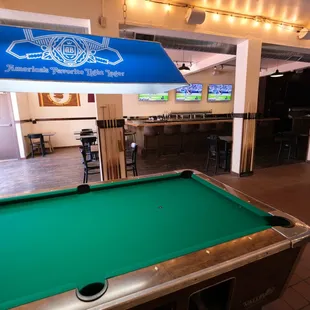 a pool table in a bar